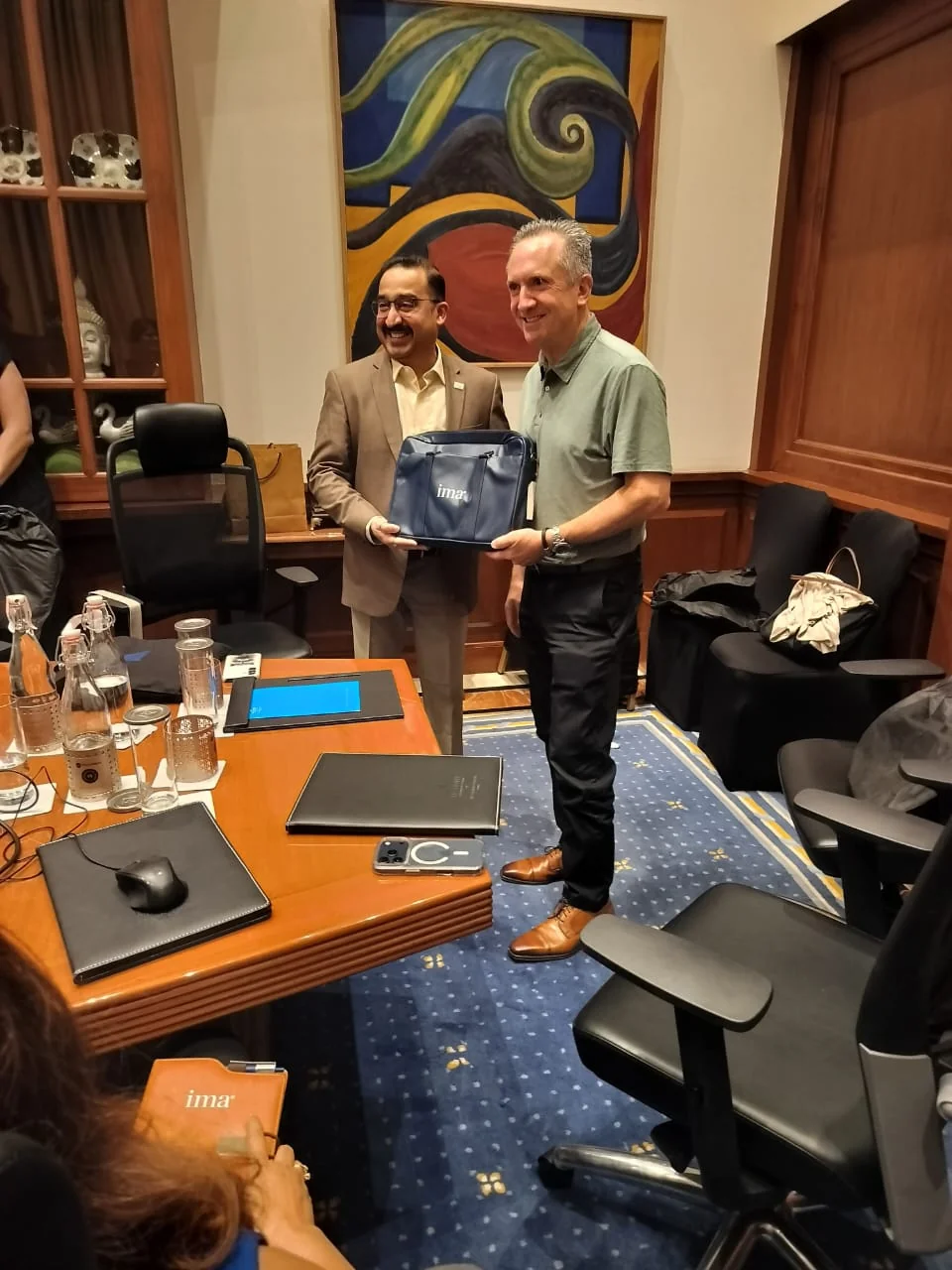 ima26 branded laptop bag handover at the Mumbai conference
