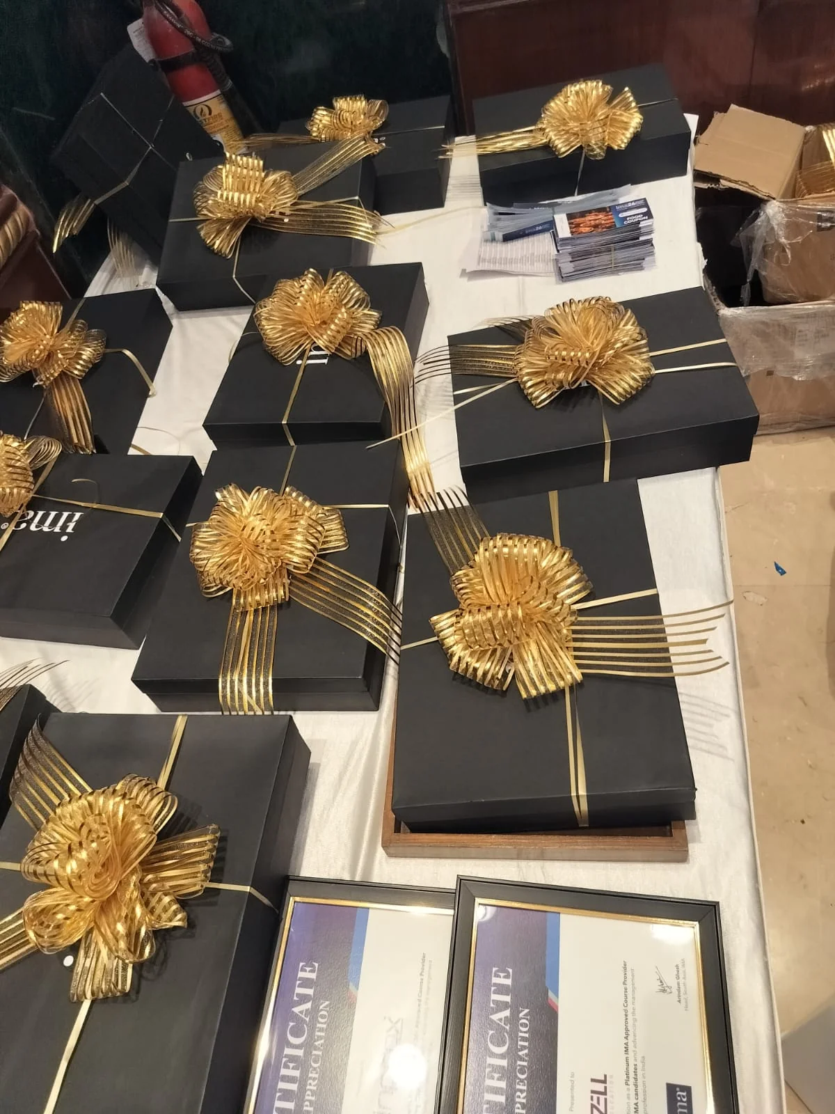 ima26 Mumbai black-and-gold conference gift boxes by Saif Gifting