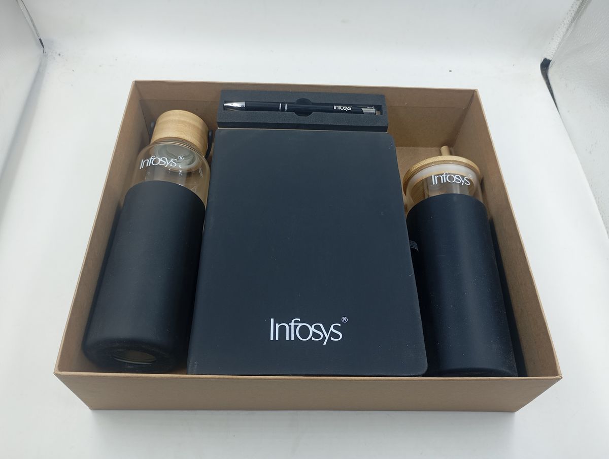 Infosys eco gift kit with glass bottles, notebook and pen in a kraft box