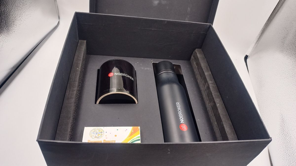 NoBroker branded mug and steel bottle in a black gift box