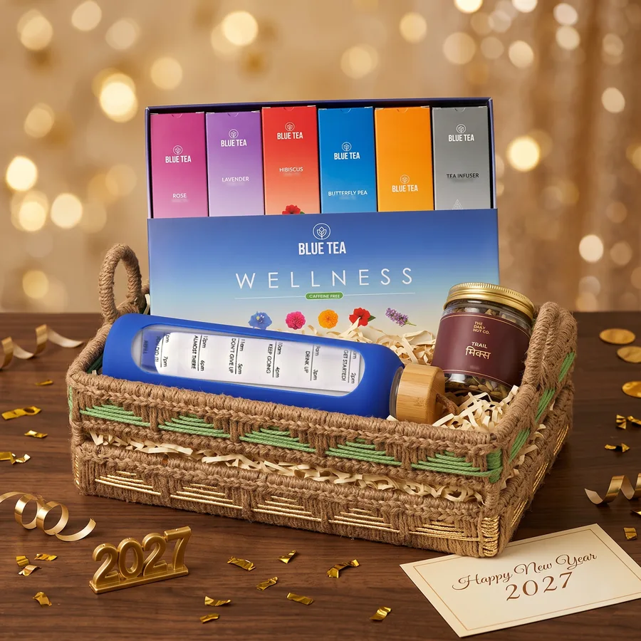 Resolution Wellness Box New Year corporate gift hamper – opened, showing Reminder Glass Bottle, Wellness Tea Gift Box and Trail Mix Jar (inside view)